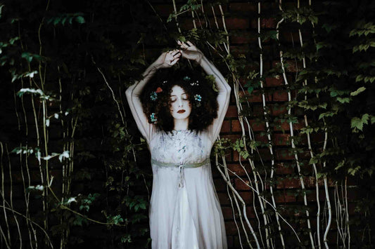 Woman in dress surrounded by nature